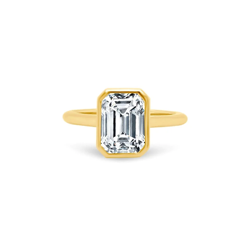 Women's rings hand-coiled-North South Bezel Set Emerald Cut Solitaire